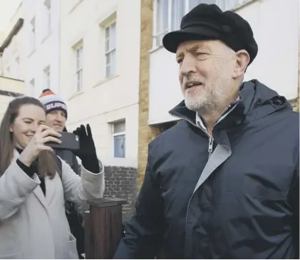  ??  ?? 0 Jeremy Corbyn in his trademark cap, which at a certain angle and in a certain light looks a little bit Russian