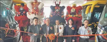  ??  ?? Lo (second left) cuts a ribbon to launch the new buses. From left are Wilson, Abang Muhamad Yasin, Michelle, and Phang.