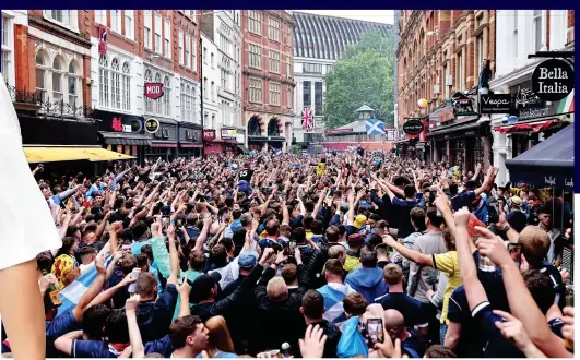  ??  ?? Who are you? Huge crowd of fans gather near Leicester Square, ignoring travel advice and social distancing