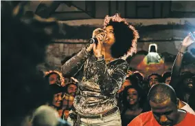  ??  ?? All-female samba groups cut down on harassment, women say. Doralyce Gonzaga singing with a mostly male circle in downtown Rio de Janeiro.