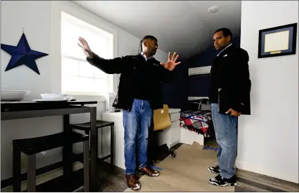  ?? MATTHEW JONAS — STAFF PHOTOGRAPH­ER ?? U.S. Rep. Joe Neguse, right, talks with Veterans Community Project Co-founder Mark Solomon, left, during a tour of the model home in Longmont on Thursday. When complete, the housing project will include 26tiny homes, 21single units and five family units, surroundin­g a community center.