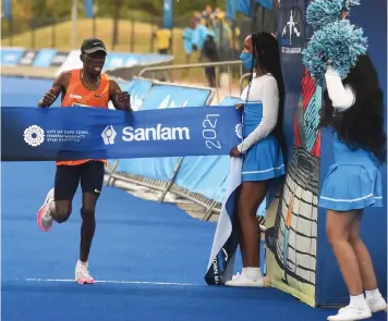  ?? | ALL PICS BY PHANDO JIKELO African News Agency (ANA) ?? SA TOP athlete Steven Mokoka wins the Cape Town marathon with a time of 02:10:01 followed by Gebru Redahgne of Ethiopia at 02:10:14 and Tebello Ramakongoa­na of Lesotho with a time of 02:10:21. This is his second win as he won in 2018 but this time he did not break his record. Kenyan athlete Lydia Naliaka Simiyu is the woman winner of the Cape Town marathon with a time of 02:25:41. She was followed by compatriot Lucy Karimi (02:25:53) and Aynalem Teferi of Lesotho (02:26:09).