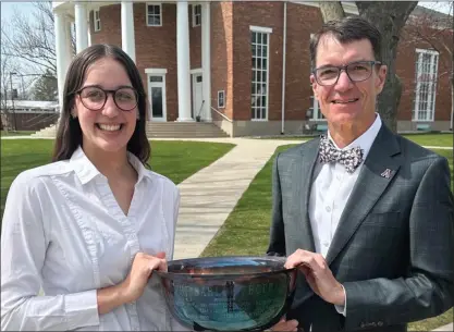  ?? PHOTO COURTESY ALMA COLLEGE ?? Alma College senior Taylor Neeb, winner of the Barlow Trophy, poses with Alma College President Jeff Abernathy.