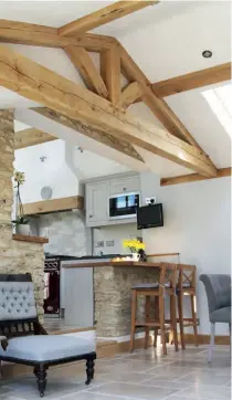  ??  ?? Above: In this barn conversion, the upper trusses have been used as an attractive detail that links to the building’s original use and brings some wow factor into the home