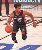 ?? KIM KLEMENT/USA TODAY SPORTS ?? Jimmy Butler posted the third 40-point triple-double in NBA Finals history Sunday in the Heat’s victory.