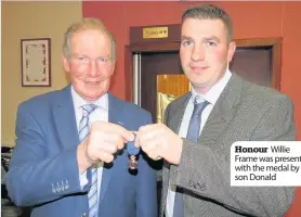  ??  ?? Honour Willie Frame was presented with the medal by his son Donald