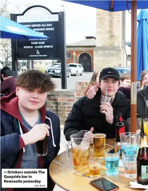  ?? Iain Buist ?? > Drinkers outside The Quayside bar in Newcastle yesterday