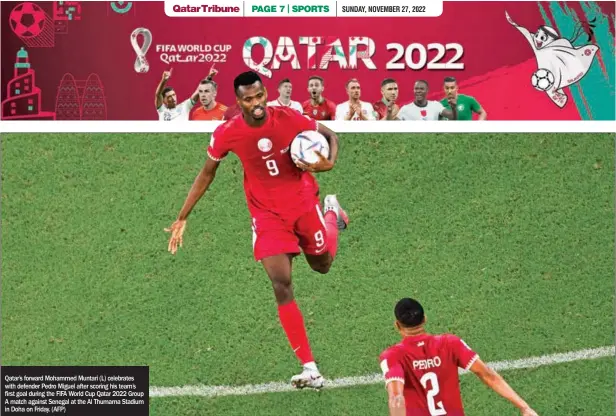  ?? ?? Qatar’s forward Mohammed Muntari (L) celebrates with defender Pedro Miguel after scoring his team’s first goal during the FIFA World Cup Qatar 2022 Group A match against Senegal at the Al Thumama Stadium in Doha on Friday. (AFP)