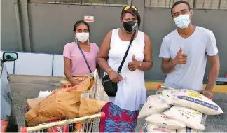  ?? ?? Members of Diversity Awareness after purchasing groceries to be donated to families.