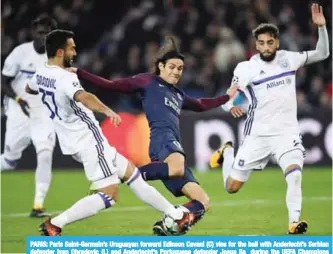  ??  ?? PARIS: Paris Saint-Germain’s Uruguayan forward Edinson Cavani (C) vies for the ball with Anderlecht’s Serbian defender Ivan Obradovic (L) and Anderlecht’s Portuguese defender Josue Sa during the UEFA Champions League Group B football match.