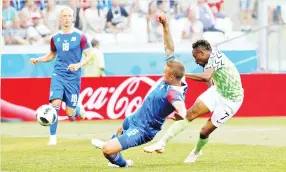  ??  ?? AHMED Musa melakukan rembatan cantik untuk gol pertama Nigeria ketika menentang Iceland di Volgograd, Russia. -Gambar REUTERS