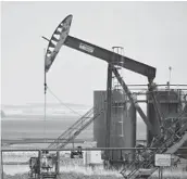  ?? MATTHEW BROWN/AP ?? A pump jack on the Fort Berthold Indian Reservatio­n in North Dakota. The reservatio­n sits atop one of the biggest oil discoverie­s in the U.S. in decades.