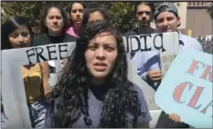  ??  ?? In this photo from a video provided by the National Day Laborer Organizing Network, Claudia Rueda, (front), thanks supporters after her release from the Otay Mesa Detention Center on Friday in San Diego. AP PHOTO