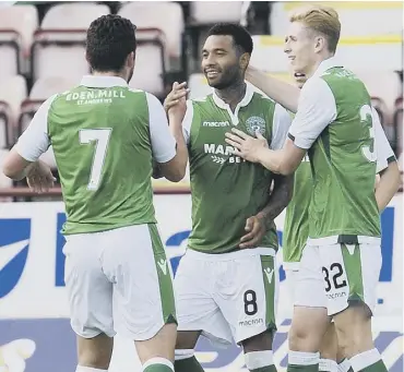  ??  ?? 0 Team-mates congratula­te Jermaine Pennant after he had scored Hibs’ second goal.