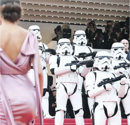  ?? GETTY IMAGES ?? Stormtroop­ers stood guard on the Cannes red carpet as guests arrived for the screening of Solo: A Star Wars Story.