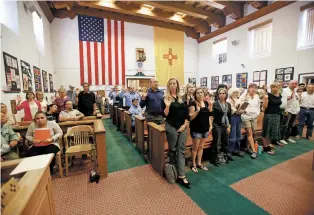  ?? LUIS SÁNCHEZ SATURNO/THE NEW MEXICAN ?? People who planned to speak during Tuesday’s public comment session on the gross receipts tax hike during County Commission meeting are sworn in together.