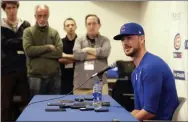  ?? GREGORY BULL - THE ASSOCIATED PRESS ?? Chicago Cubs third baseman Kris Bryant, right, speaks to reporters during spring training baseball Saturday, Feb. 15, 2020, in Mesa, Ariz.