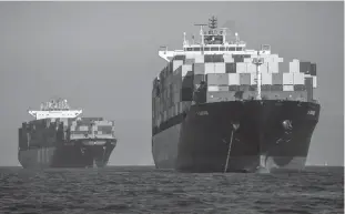  ?? Tribune News Service/getty Images ?? A view of some of the dozens of container ships siting off the coast of the Ports of Los Angeles and Long Beach, waiting to be unloaded Oct. 13.