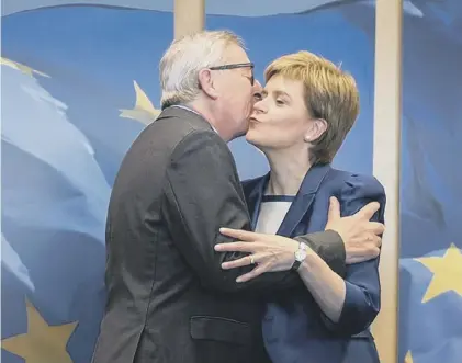  ??  ?? 0 Mutual attraction: Jean-claude Juncker and Nicola Sturgeon are on the same wavelength, even if London is not