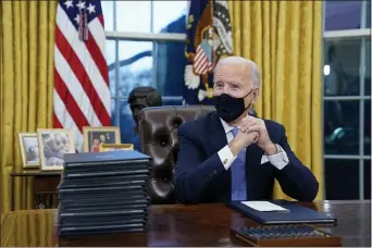 ?? EVAN VUCCI — THE ASSOCIATED PRESS FILE ?? In this Jan. 20, 2021, file photo President Joe Biden waits to sign his first executive order in the Oval Office of the White House in Washington.