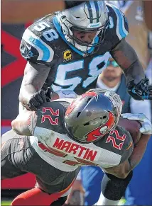  ?? CHARLOTTE OBSERVER ?? UGA product Thomas Davis (58, leveling Bucs running back Doug Martin on Sunday) leads a Panthers linebacker corps that is considered among the league’s best.