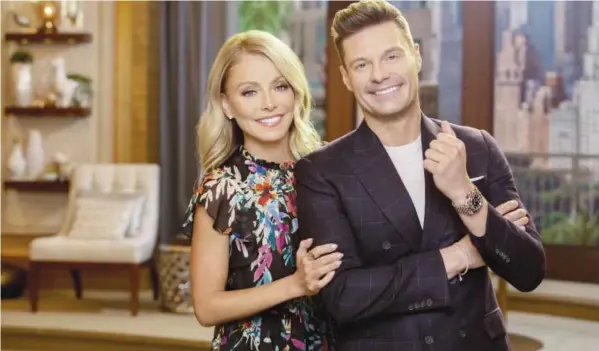  ?? ?? Ryan Seacrest (right) with “Live with Kelly and Ryan” co-host Kelly Ripa