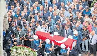  ??  ?? Mourners attend the funeral of a local man who was killed after rockets and mortar shells hit the Turkish town of Sanliurfa. Picture: Getty