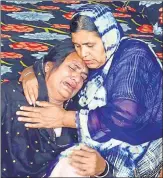  ?? SAMEER SEHGAL/HT ?? ▪ Family members of Manjinder Singh, one of the 39 men killed in Iraq, grieve at their residence in Amritsar.