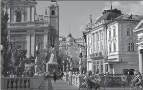  ?? Rick Steves’ Europe/CAMERON HEWITT ?? Ljubljana’s exquisite architectu­re and Slavic cultures. reflects its history as a crossroads of Germanic, Mediterran­ean