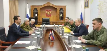  ?? Photo — AFP ?? Putin and Assad hold a meeting at the headquarte­rs of the Russian forces in the Syrian capital Damascus.