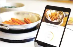  ??  ?? Using Bluetooth technology and embedded sensors, the smart saute pan, induction burner and recipe app work in unison to assist you. — Hestan photo