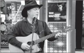  ??  ?? Garth Brooks performs on a recent edition of ABC’s Good Morning America. The country superstar will perform on the 2014 American Music Awards, which airs at 7 p.m. today on ABC.