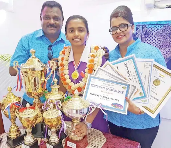  ??  ?? Raneesha Chandra with her parents Rakesh and Rukshana.