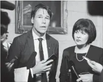  ?? JUSTIN TANG THE CANADIAN PRESS ?? Minister of Health Ginette Petitpas Taylor stands with Eric Hoskins, former Ontario Minister of Health, after the tabling of the budget in the House of Commons on Parliament Hill in Ottawa last week. Hoskins will chair a federal government advisory...