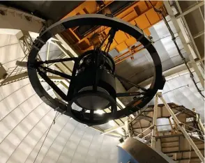  ??  ?? ▼ On the rise: DESI’s corrector joins the Mayall Telescope at its Kitt Peak home in 2018