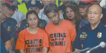  ??  ?? ARNEL and Leonady Ordonio, suspects in a multimilli­on-peso scam, are presented to the media at Camp Crame on Tuesday, April 10.