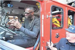  ??  ?? Heavyweigh­t Deontay Wilder, promoting his next fight at a Los Angeles fire station, is 40-0 with 39 knockouts and a WBC world title.