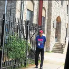  ?? PEG DEGRASSA — DIGITAL FIRST MEDIA ?? Ronald Tolliver, of Chester, walks outside of the Catholic Social Services building where the Coffee Club is located. CSS is housed in the former Saint Michael’s at 130 E. Seventh St. Chester.