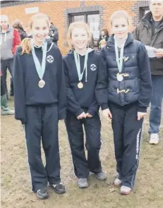  ??  ?? The victorious Under 13 girls team from Peterborou­gh AC. They are Casey Hilliam ( 3rd), Paige Nealon ( 8th) and Megan Porter ( 11th).