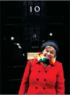  ??  ?? SPARKED CONTROVERS­Y: Catriona Laing in the scarf outside Number 10