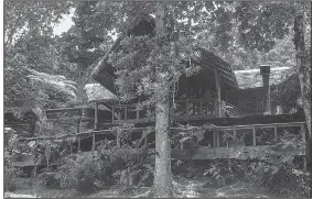  ?? TNS/STEVE HAGGERTY ?? Pacuare Lodge, a National Geographic- designated Unique Lodge of the World, was built of local wood among rain forest trees on the Pacuare River and includes a central hall, lively bar and an indoor-outdoor dining area. Over 18 guest cottages range...