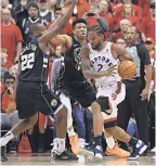  ?? DAN HAMILTON/USA TODAY SPORTS ?? Kawhi Leonard’s offense and defense on Giannis Antetokoun­mpo, center, was the difference for the Raptors.