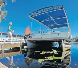  ?? RED HUBER/STAFF PHOTOGRAPH­ER ?? Erica Hefti, left, and her husband Hans, from Glarus, Switzerlan­d, prepare to board a St. Johns River Tours boat. Central Florida business owners who rely on the St. Johns River for boaters, fishermen and tourists are finally beginning to return to...