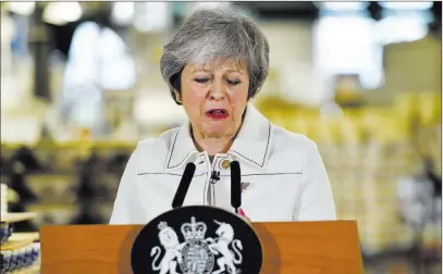  ?? Ben Birchall The Associated Press ?? Britain’s Prime Minister Theresa May delivers a speech during a visit Monday to a pottery factory in Stoke-on-trent, England.