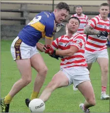  ??  ?? Shay Boggan of St. Mary’s (Rosslare) and James Tonks (Ferns St. Aidan’s) contest this 50-50 ball.