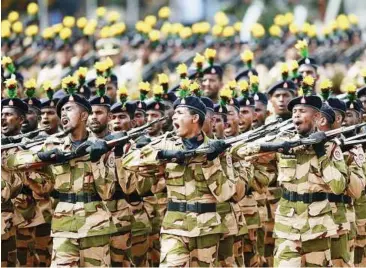  ??  ?? Parade for the fallen: Soldiers marching during a War Victory parade in Colombo yesterday. Sri Lanka held a military parade and memorial for fallen soldiers to mark the third anniversar­y of the defeat of the Tamil Tigers. — Reuters