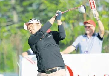  ??  ?? Chonlada Chayanun hits a tee shot during the first round yesterday.