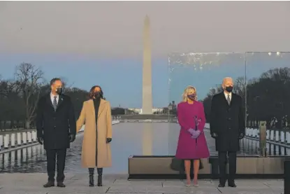  ?? GETTY IMAGES CHIP SOMODEVILL­A/ ?? ABOVE: Douglas Emhoff (from left), Vice President-elect Kamala Harris, Jill Biden and President-elect Joe Biden attend a COVID-19 memorial service at the Lincoln Memorial on Tuesday.