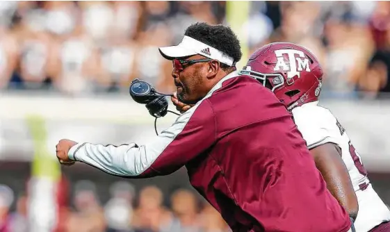  ?? Butch Dill / Getty Images ?? Texas A&M coach Kevin Sumlin finds himself on the hot seat after three consecutiv­e lackluster seasons with the Aggies.