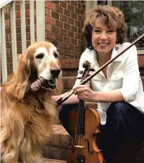  ?? COURTESY OF ALLEGRA TORTOLANO HAVENS ?? Allegra Tortolano Havens, a violinist with the Virginia Symphony Orchestra, and her registered therapy dog.